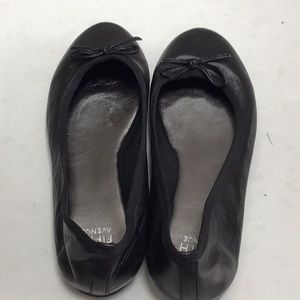 Black leather flats
